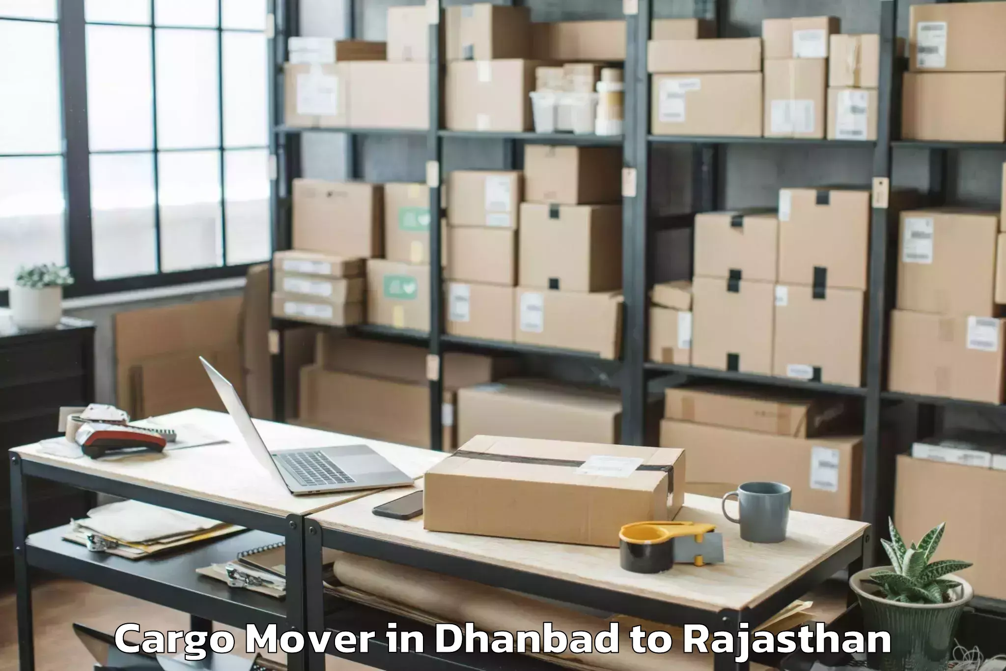 Reliable Dhanbad to Opjs University Churu Cargo Mover